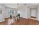 Bright living room featuring hardwood floors, a chandelier, and a welcoming entryway at 3007 Live Oak Ln, Palmetto, FL 34221