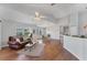 Bright and open living area with hardwood floors and a comfortable, leather sofa at 3007 Live Oak Ln, Palmetto, FL 34221