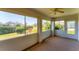 Enclosed lanai offering scenic views of the landscaped backyard at 3007 Live Oak Ln, Palmetto, FL 34221