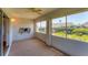 Bright enclosed lanai features wall to wall windows, offering plenty of natural light and views at 3007 Live Oak Ln, Palmetto, FL 34221