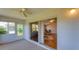 Enclosed lanai leading to living room offers additional living space with tiled flooring at 3007 Live Oak Ln, Palmetto, FL 34221