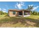 Stucco home featuring screened lanai perfect for outdoor dining and entertaining in partially shaded backyard at 3453 Dryden St, North Port, FL 34288