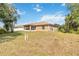 Spacious backyard features a screened lanai, perfect for entertaining and enjoying outdoor living at 3453 Dryden St, North Port, FL 34288