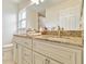 Bathroom featuring a granite-topped, double sink vanity and tile floors at 3453 Dryden St, North Port, FL 34288