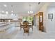 This naturally lit dining room features neutral tile, and flows seamlessly into the kitchen at 3453 Dryden St, North Port, FL 34288