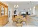 Bright dining area featuring tile floors and seamless flow into living room and kitchen, perfect for entertaining at 3453 Dryden St, North Port, FL 34288