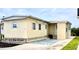 Charming manufactured home featuring a light-colored exterior and well-maintained landscaping at 36 N Starboard Dr, Venice, FL 34285