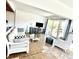 Bright living room with lots of windows, a white sofa, and an open floor plan at 36 N Starboard Dr, Venice, FL 34285