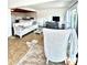 This cozy living room features a comfortable sofa, entertainment center, and ample natural light streaming through the windows at 36 N Starboard Dr, Venice, FL 34285