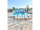 Sparkling community pool with sun loungers and decorative murals, perfect for leisure and relaxation at 36 N Starboard Dr, Venice, FL 34285