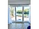 Sliding glass doors offering stunning water views and access to the home's private dock at 36 N Starboard Dr, Venice, FL 34285