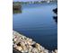 Scenic waterfront view showcasing a tranquil body of water with stone shoreline at 36 N Starboard Dr, Venice, FL 34285