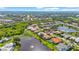 Stunning aerial perspective of a community with lakes and lush green spaces, highlighting the desirable location at 4180 Via Mirada, Sarasota, FL 34238
