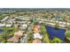 Scenic aerial view of a neighborhood featuring waterfront properties and lush landscaping at 4180 Via Mirada, Sarasota, FL 34238