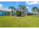 Large backyard with lake view and pool area at 4180 Via Mirada, Sarasota, FL 34238