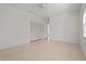 Bedroom featuring tile floors, ample closet space, and great natural lighting at 4180 Via Mirada, Sarasota, FL 34238