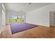 Bright bedroom with wood floors, large windows, and a view of the backyard at 4180 Via Mirada, Sarasota, FL 34238