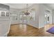 Dining room with wood floors and view of the pool outside at 4180 Via Mirada, Sarasota, FL 34238