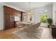 Elegant dining room featuring a stunning chandelier and ample natural light at 4180 Via Mirada, Sarasota, FL 34238