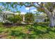 Charming single-story home with lush landscaping and a well-manicured front lawn at 4180 Via Mirada, Sarasota, FL 34238