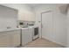 Functional laundry room equipped with a washer, dryer, sink, and overhead storage at 4180 Via Mirada, Sarasota, FL 34238