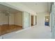 Living room with wood floors leading to a patio and has sliding glass doors at 4180 Via Mirada, Sarasota, FL 34238