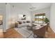 Bright and airy living room with stylish furniture and a view of the pool area at 4180 Via Mirada, Sarasota, FL 34238