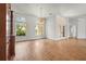 Elegant living room featuring hardwood floors, a chandelier, and large windows at 4180 Via Mirada, Sarasota, FL 34238
