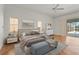 Serene main bedroom with natural light, featuring hardwood floors, and access to the lanai at 4180 Via Mirada, Sarasota, FL 34238