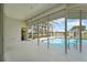 Pool area featuring covered patio with roll down shutter and view of the pool and lake at 4180 Via Mirada, Sarasota, FL 34238