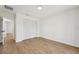 Spacious bedroom with vinyl plank floors, white walls, and double door closet at 4265 Hoffman Ave, Spring Hill, FL 34606