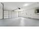 Clean and spacious garage with a working garage door, offering ample space for parking and storage at 4265 Hoffman Ave, Spring Hill, FL 34606