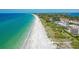 Beautiful beachfront condo community with Gulf views, lush landscaping, and private beach access at 4800 Gulf Of Mexico Dr # 204, Longboat Key, FL 34228