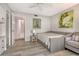 Neutral bedroom featuring daybed, soft colors, and wood-look floors at 4800 Gulf Of Mexico Dr # 204, Longboat Key, FL 34228