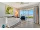 Cozy bedroom with water view, ceiling fan, and daybed at 4800 Gulf Of Mexico Dr # 204, Longboat Key, FL 34228