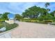 Inviting entrance to Wildwood Bay community featuring lush landscaping and a private residential setting at 4800 Gulf Of Mexico Dr # 204, Longboat Key, FL 34228