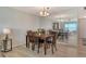 Elegant dining area featuring wood furnishings and a stunning water view through the large mirror at 4800 Gulf Of Mexico Dr # 204, Longboat Key, FL 34228