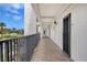 Exterior hallway with balcony and apartment doors at 4800 Gulf Of Mexico Dr # 204, Longboat Key, FL 34228
