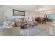 Spacious living room with a comfortable couch, stylish decor, and a dining area at 4800 Gulf Of Mexico Dr # 204, Longboat Key, FL 34228