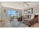 Bright living room with comfortable seating and stunning waterfront views at 4800 Gulf Of Mexico Dr # 204, Longboat Key, FL 34228