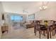 Inviting living room featuring water views, comfortable seating, and a dining area at 4800 Gulf Of Mexico Dr # 204, Longboat Key, FL 34228