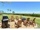Outdoor patio includes a barbecue, fire pit and ample seating with lovely views at 4800 Gulf Of Mexico Dr # 204, Longboat Key, FL 34228