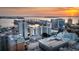 Stunning sunset view of high-rise buildings along the bay, showcasing the vibrant city skyline at 50 Central Ave # 17Phd, Sarasota, FL 34236