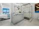 Well-lit bathroom featuring modern vanity with a glass bowl sink, plus a stylish glass door shower and views at 50 Central Ave # 17Phd, Sarasota, FL 34236