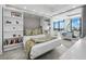 Beautiful bedroom featuring a built-in Murphy bed and shelves plus floor-to-ceiling windows with great natural light at 50 Central Ave # 17Phd, Sarasota, FL 34236