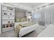 Beautiful bedroom featuring a built-in Murphy bed and shelves plus floor-to-ceiling windows with great natural light at 50 Central Ave # 17Phd, Sarasota, FL 34236