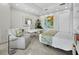 A serene bedroom featuring a cozy seating area, a sleek desk, and stylish decor at 50 Central Ave # 17Phd, Sarasota, FL 34236