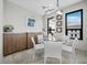 Bright breakfast nook featuring a glass table and contemporary decor at 50 Central Ave # 17Phd, Sarasota, FL 34236