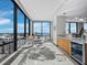 Elegant dining area with panoramic city views and a modern bar area, perfect for entertaining guests at 50 Central Ave # 17Phd, Sarasota, FL 34236