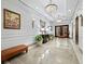 Refined hallway boasts marble floors, tasteful decor, and convenient elevator access at 50 Central Ave # 17Phd, Sarasota, FL 34236
